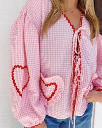 Ruby Tie Front Blouse – Baby Pink
💘 Sweet Hearts. Southern Sass. Galentine’s Ready.